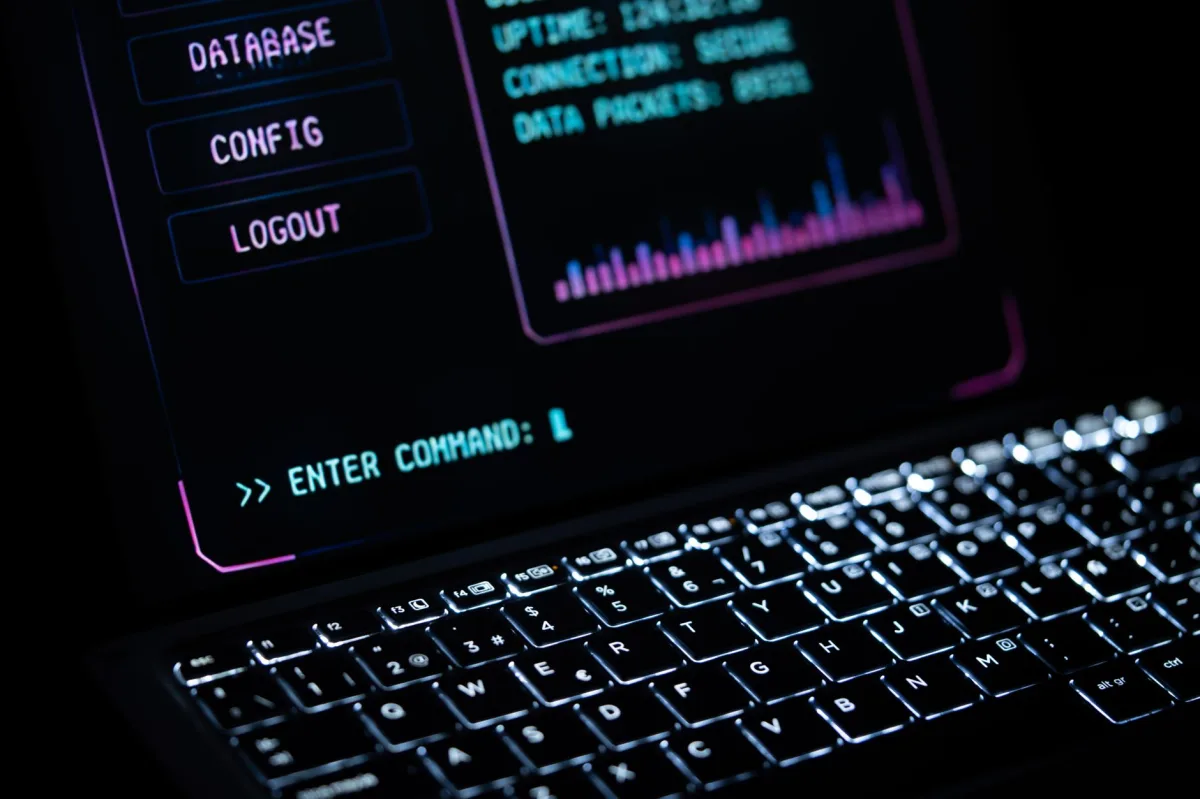 Close‑up of a glowing laptop keypad with a digital interface, representing modern security tools.
